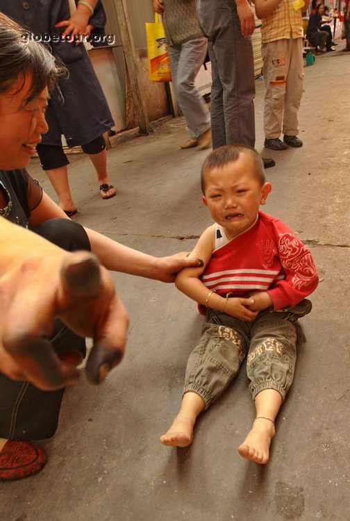 China, Xining, crying in market