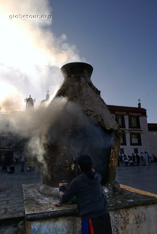 Tibet, Lhasa, pilgrims praying in frond of Jokhang temple