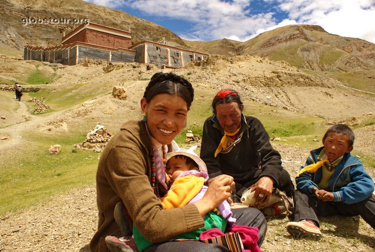 Tibet, Sakya, family in frond of monastery in mountain
