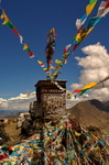 Tibet,+Shigatse,+praying+flags+in+top+of+mountain
