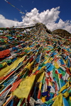 Tibet,+Shigatse,+praying+flags+in+top+of+mountain